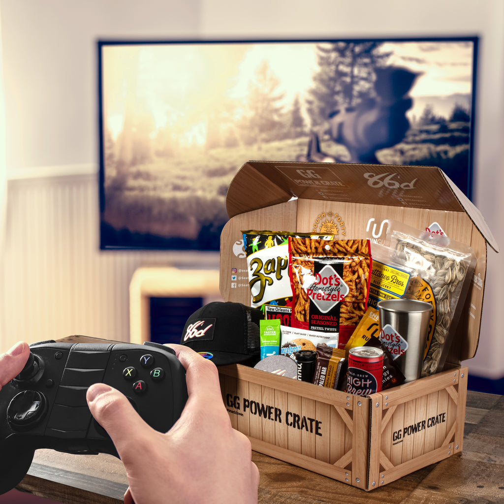 The GG Power Crate makes for the perfect video gamer gift basket shipped to your door full of gamer snacks, drinks, and video gaming merch.
